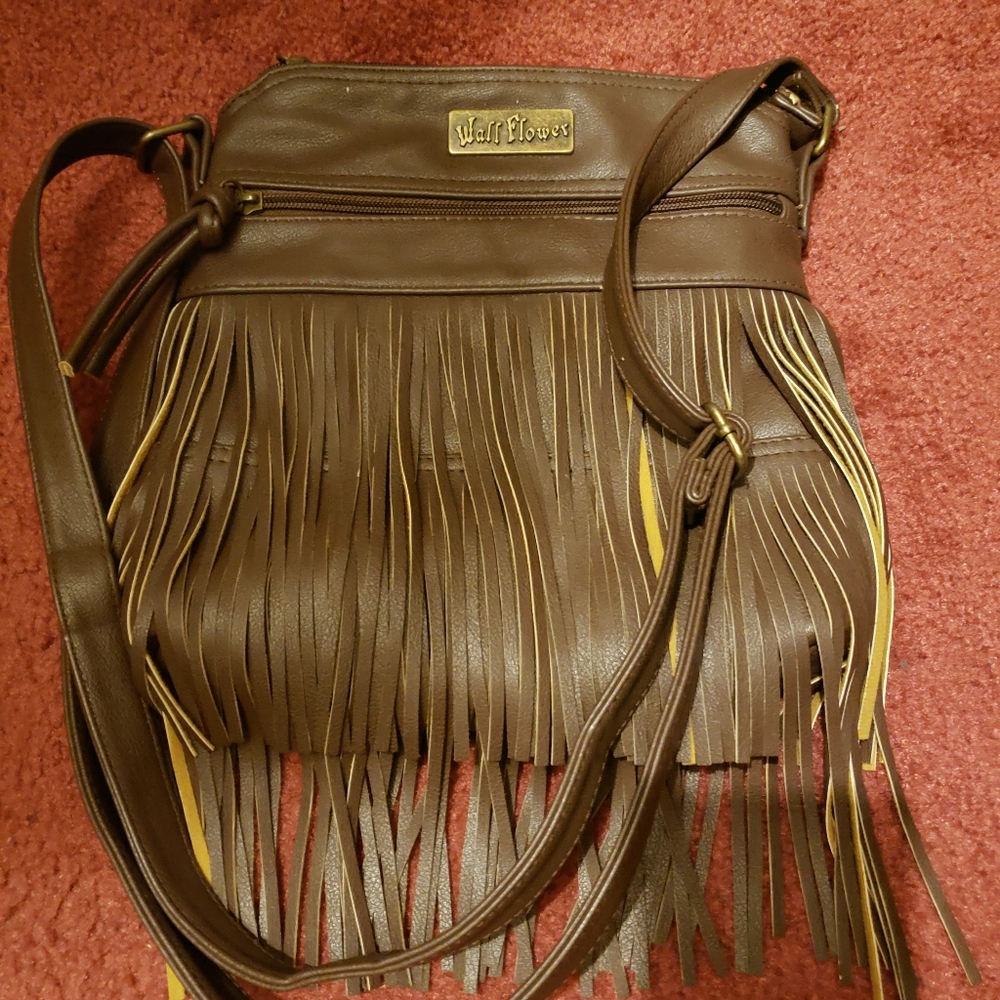 Light weight cross body satchel with tassels